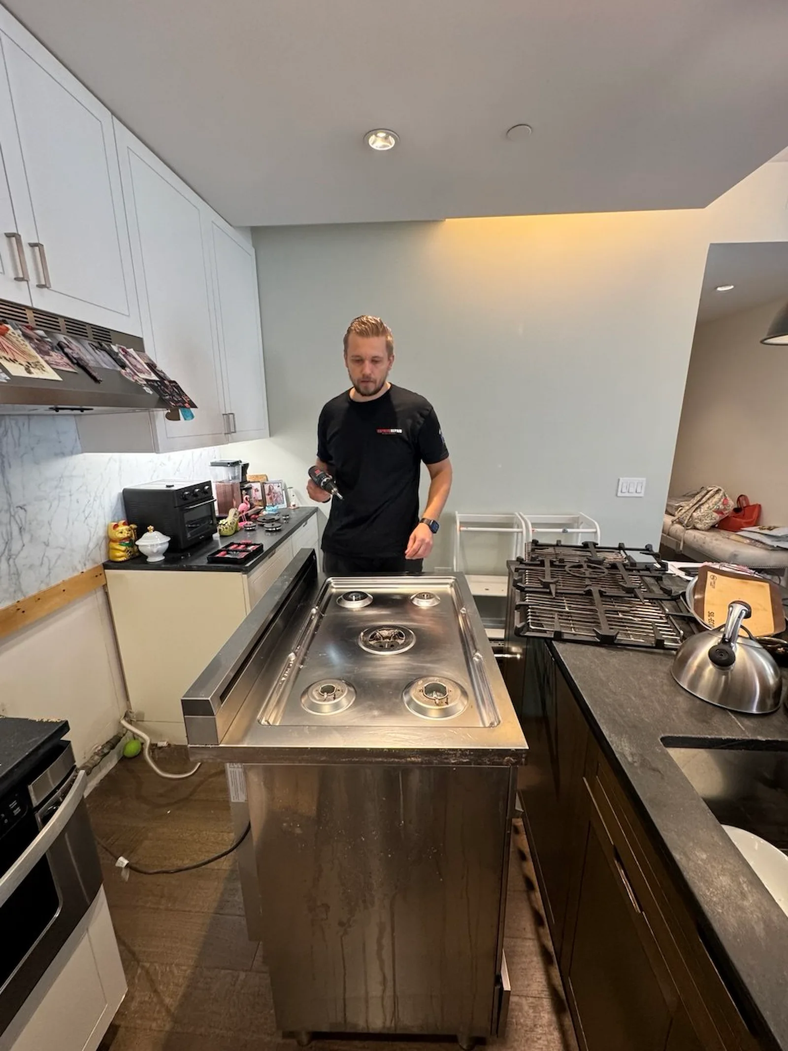 Elevate Repair technician servicing an appliance in a New York City home